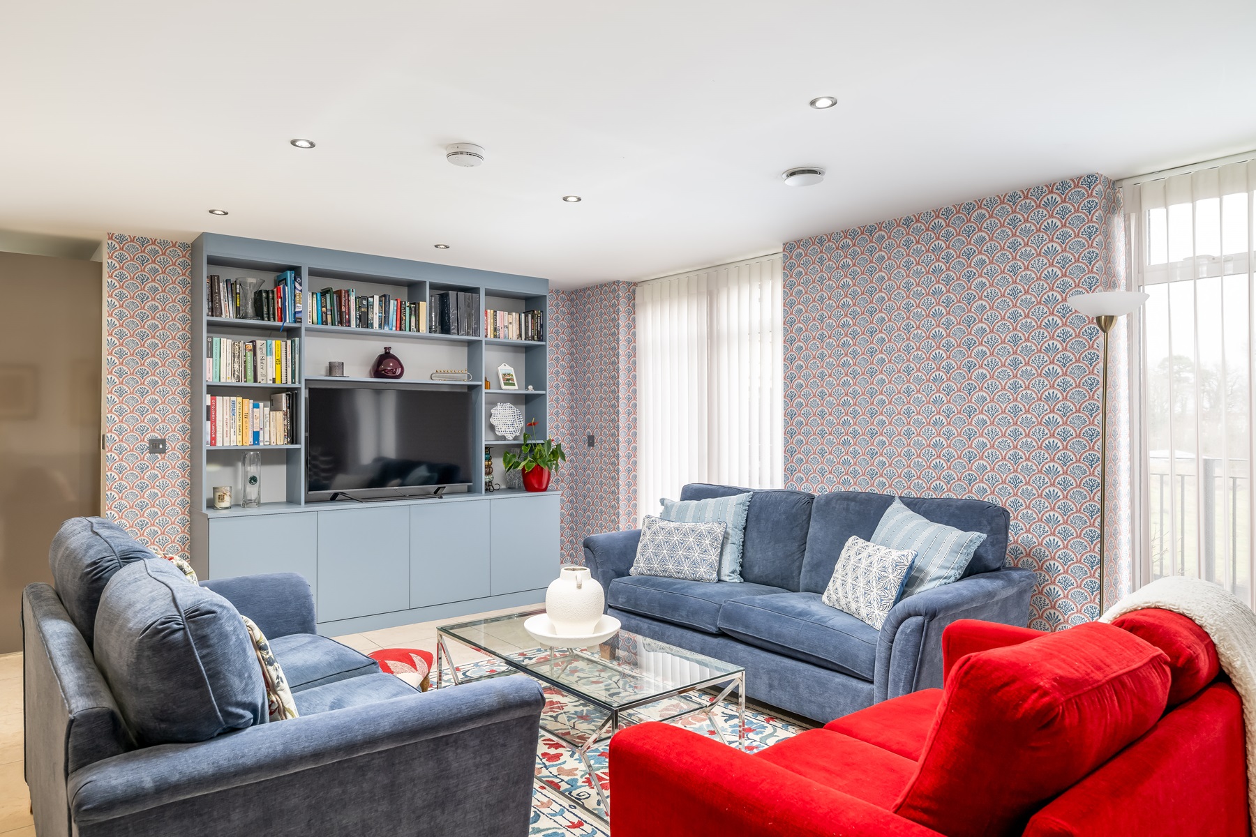 Blue white and red living room bushey interiors