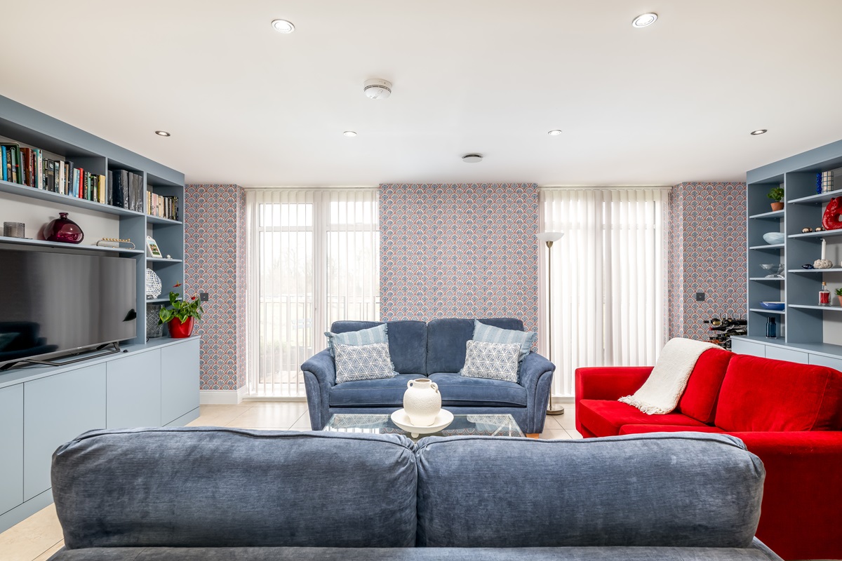 Blue white and red living room bushey interiors